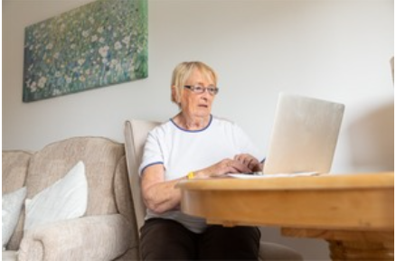 image of elderly person using laptop